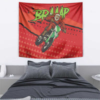 Red motocross Santa tapestry featuring central rider graphic and green BD! drip text