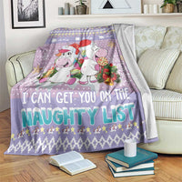 Light purple unicorn Christmas blanket draped over furniture, “naughty list” lettering
