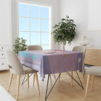 Light purple Christmas tablecloth with unicorn border and aqua 'Naughty List' lettering