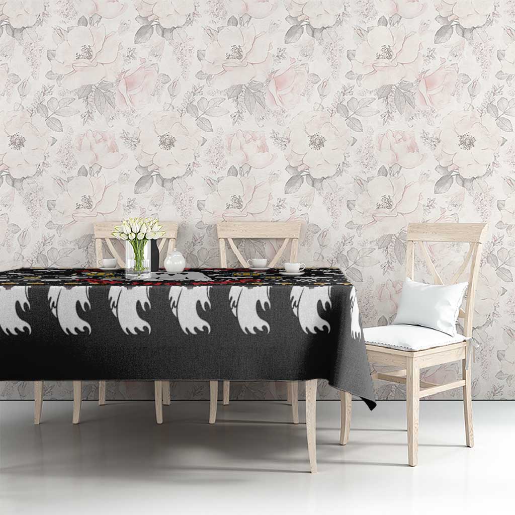 Black Halloween tablecloth with white ghost heads and beer mugs on dining table