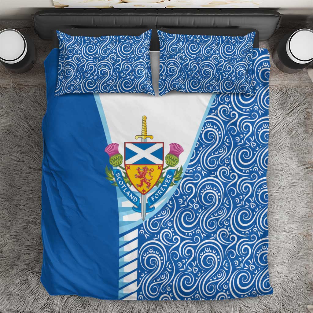 Blue bedding set with swirling pattern and central Scotland crest on white panel.