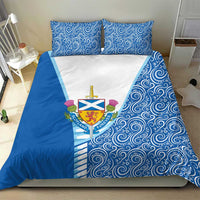Blue bedding set with two pillows, swirling pattern, and Scotland crest on white panel.