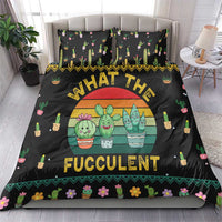 Black duvet cover with succulent characters in pots and colorful patterned border, on bed