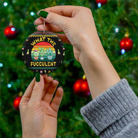 Black round cactus succulent ceramic ornament held in hand with gold hanging loop