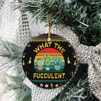 Black round cactus succulent ceramic ornament hanging on a Christmas tree
