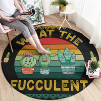 Black round cactus rug with three cactus pots and bold yellow "FUCCULENT" text