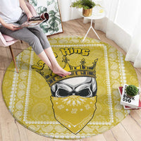 Yellow round rug with paisley edging and central king skull illustration