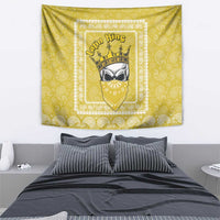 Yellow tapestry wall hanging with paisley pattern and central shield and crown emblem