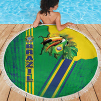 Round beach blanket with white fringe, green/yellow toucan and Brazil emblem; draped on deck