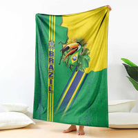 Green Brazil flag toucan blanket folded upright, with yellow and blue diagonal stripes