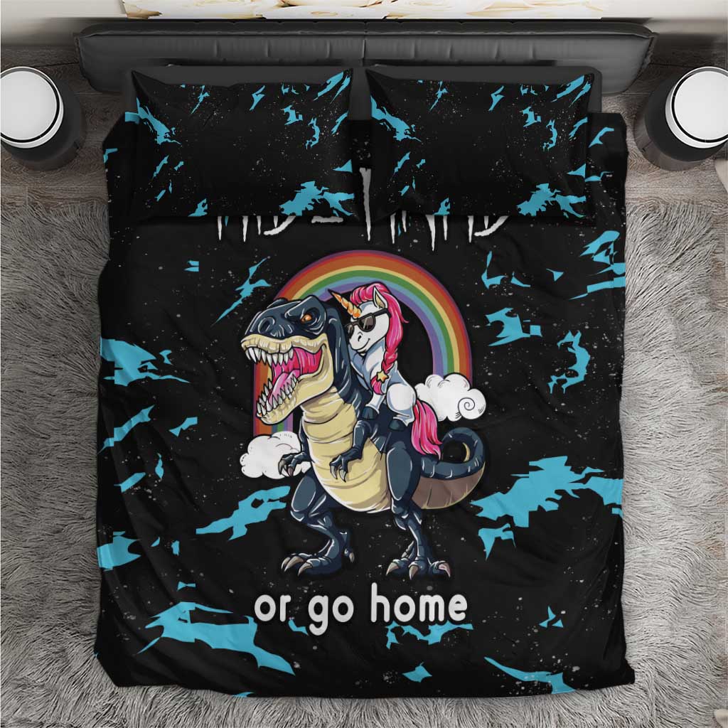 Black bedding set with blue splatter print, dinosaur and unicorn graphic, and “or go home”