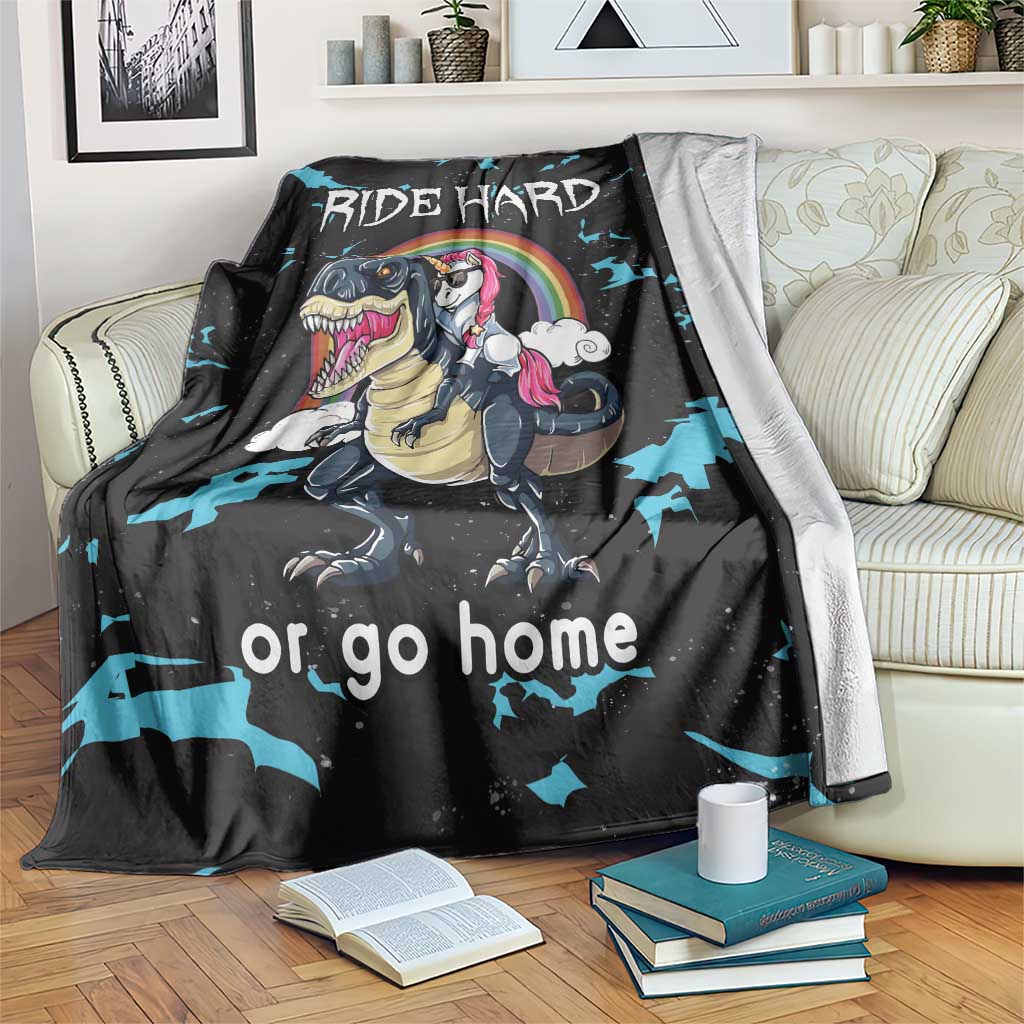 Black dinosaur and unicorn throw blanket with "RIDE HARD" text and blue splash pattern