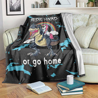 Black dinosaur and unicorn throw blanket with "RIDE HARD" text and blue splash pattern