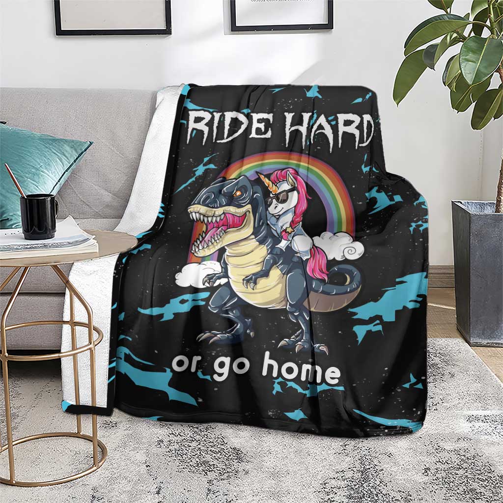 Black throw blanket with dinosaur and unicorn character art and "RIDE HARD" lettering