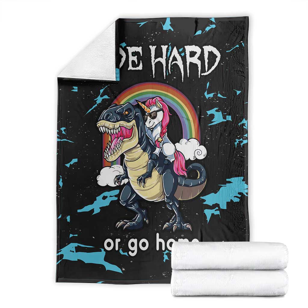 Black dinosaur and unicorn blanket set with rainbow graphic and blue splatter, folded view