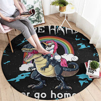 Black round carpet with unicorn and dinosaur under rainbow, blue star bursts, 'go home' text