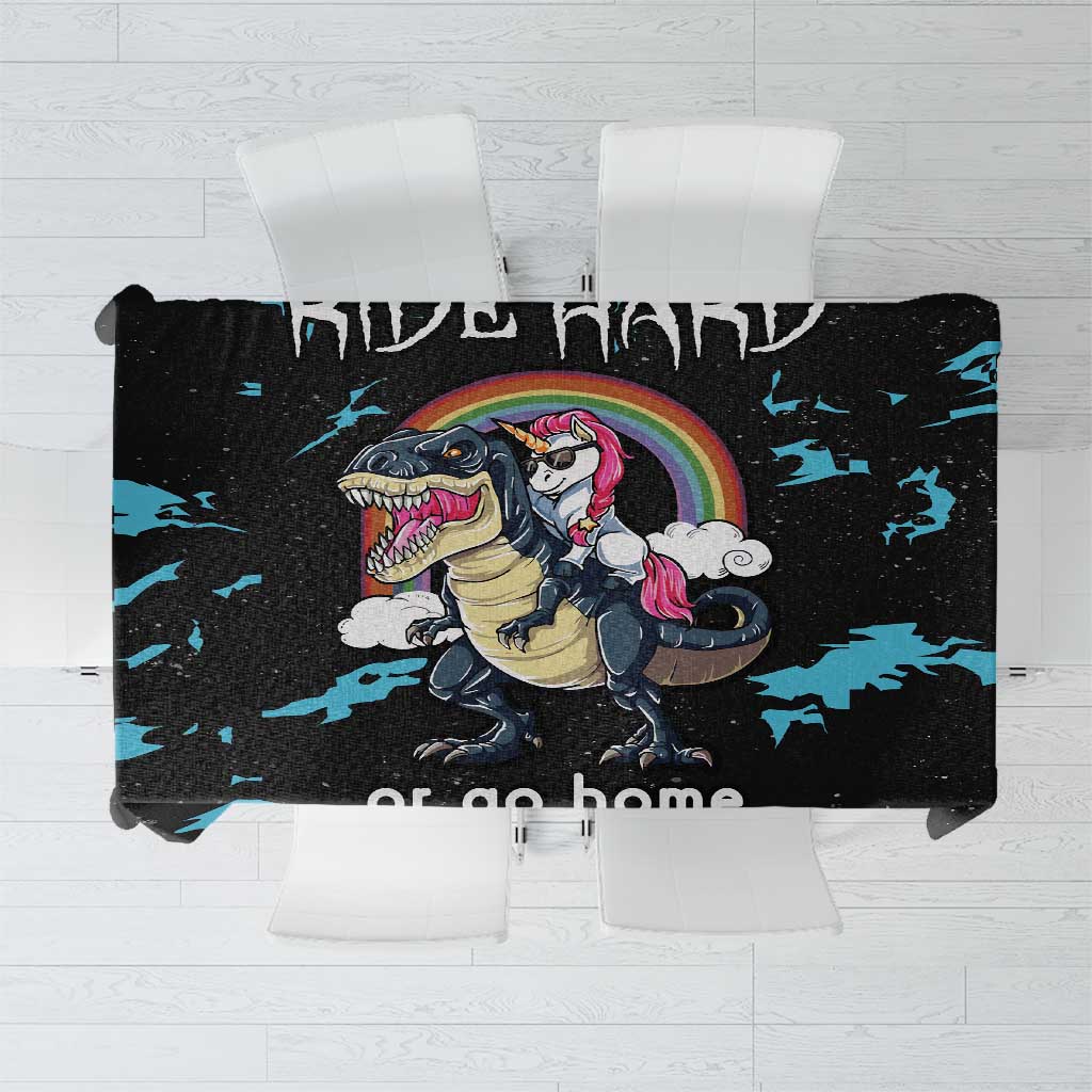 Black dinosaur unicorn tablecloth with blue splash pattern and rainbow graphic.