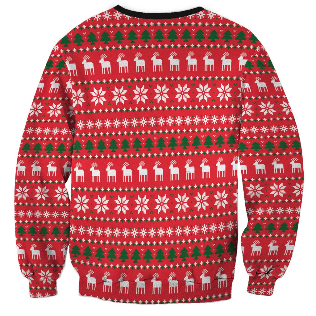 Red Christmas sweatshirt with green fair-isle pattern, reindeer and snowflake motifs
