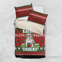 Red Christmas bedding set with dog snack graphic, two pillowcases, and green festive border
