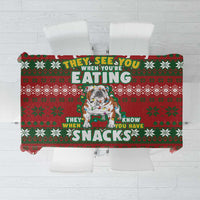 Red Christmas tablecloth with bulldog graphic and “SNACKS” text, festive green pattern