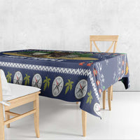 Navy tablecloth with round clock and pine leaf prints, draped over bench