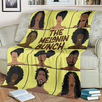 Yellow blanket featuring a grid of people faces and 'THE MELANIN BUNCH' text