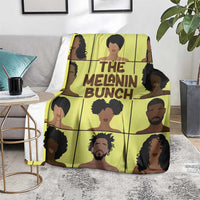 Yellow printed throw blanket with portrait collage and 'THE MELANIN BUNCH' lettering