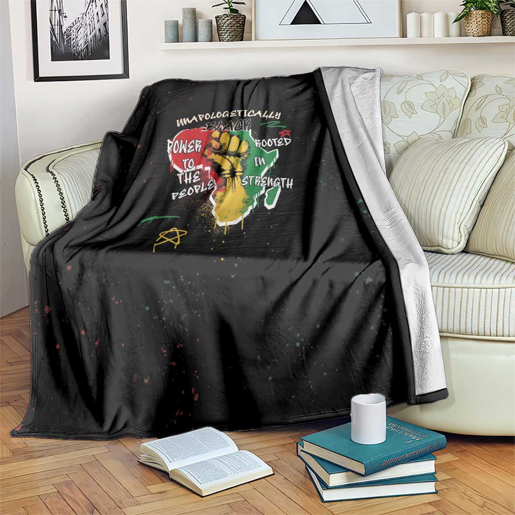 Black throw blanket with colorful African roots message graphic