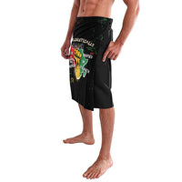 Black African wrap skirt with colorful text graphic and side drape; knee length