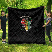 Black quilt with diamond quilting and colorful raised-hand word art, shown spread