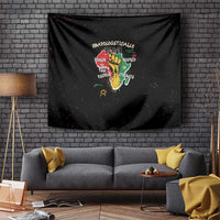 Black wall tapestry with colorful “unapologetically black” hand-and-roots graphic