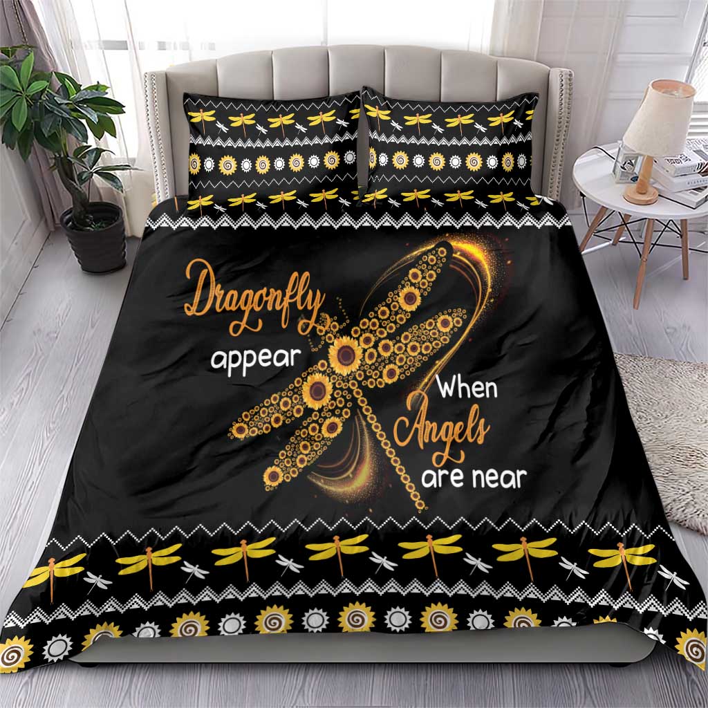 Black bedding set with gold dragonfly graphic, “When Angels are near” lettering, two pillowcases