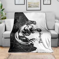 Black and white bear tattoo blanket spread across a sofa with bold bear artwork