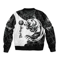 Black bomber jacket with white bear tattoo graphic, ribbed collar and cuffs, long sleeves