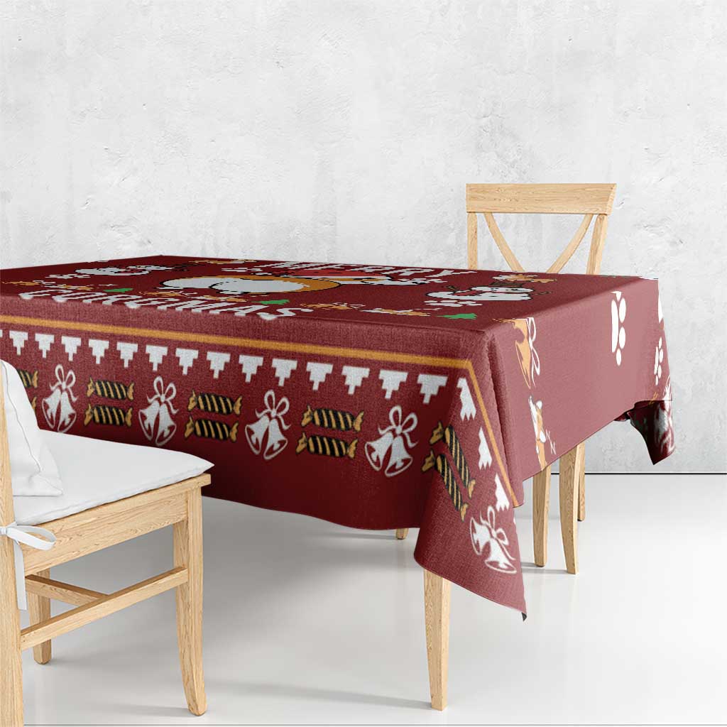 Red Christmas tablecloth draped over a bench with festive border and paw-print motifs
