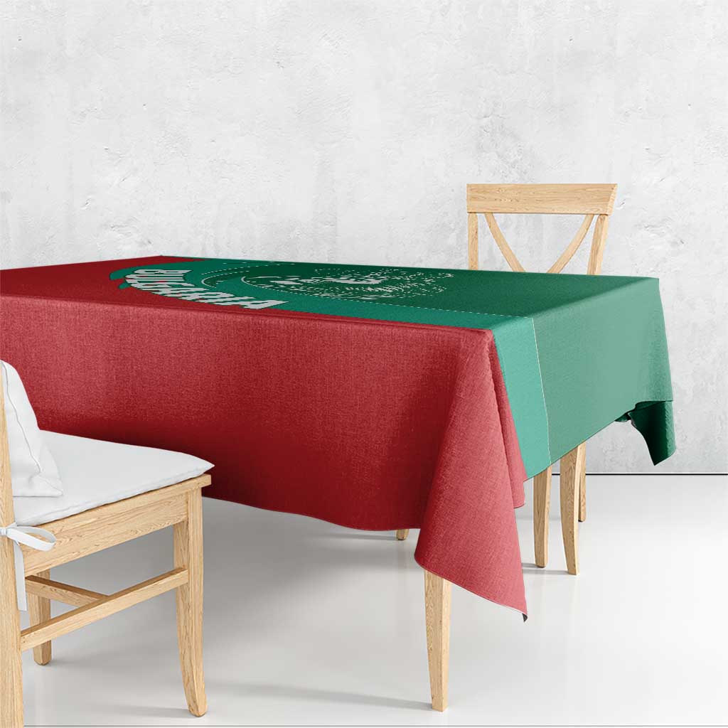 Green and red Bulgaria lion crest tablecloth draped over wooden bench and chairs