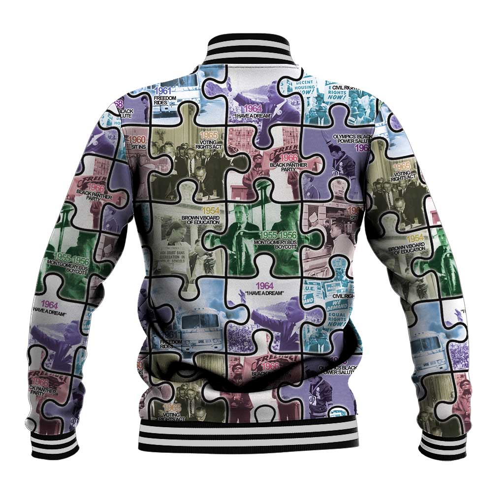 Puzzle-print baseball jacket back view, multicolor collage, ribbed striped hem and cuffs