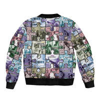 Unisex puzzle bomber jacket with colorful patchwork puzzle print, ribbed black hem and cuffs