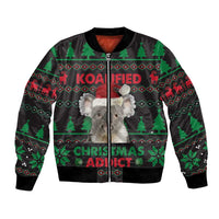 Black unisex bomber jacket with koala and Christmas graphic, zip-front and ribbed cuffs