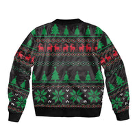 Black unisex bomber jacket back with green trees and festive pattern, ribbed hem and cuffs