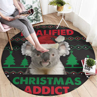 Round black koala Christmas rug with green trees and 'KOALIFIED CHRISTMAS ADDICT' text