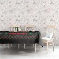 Black Christmas tablecloth with red “ADIVIT” band and green geometric pattern