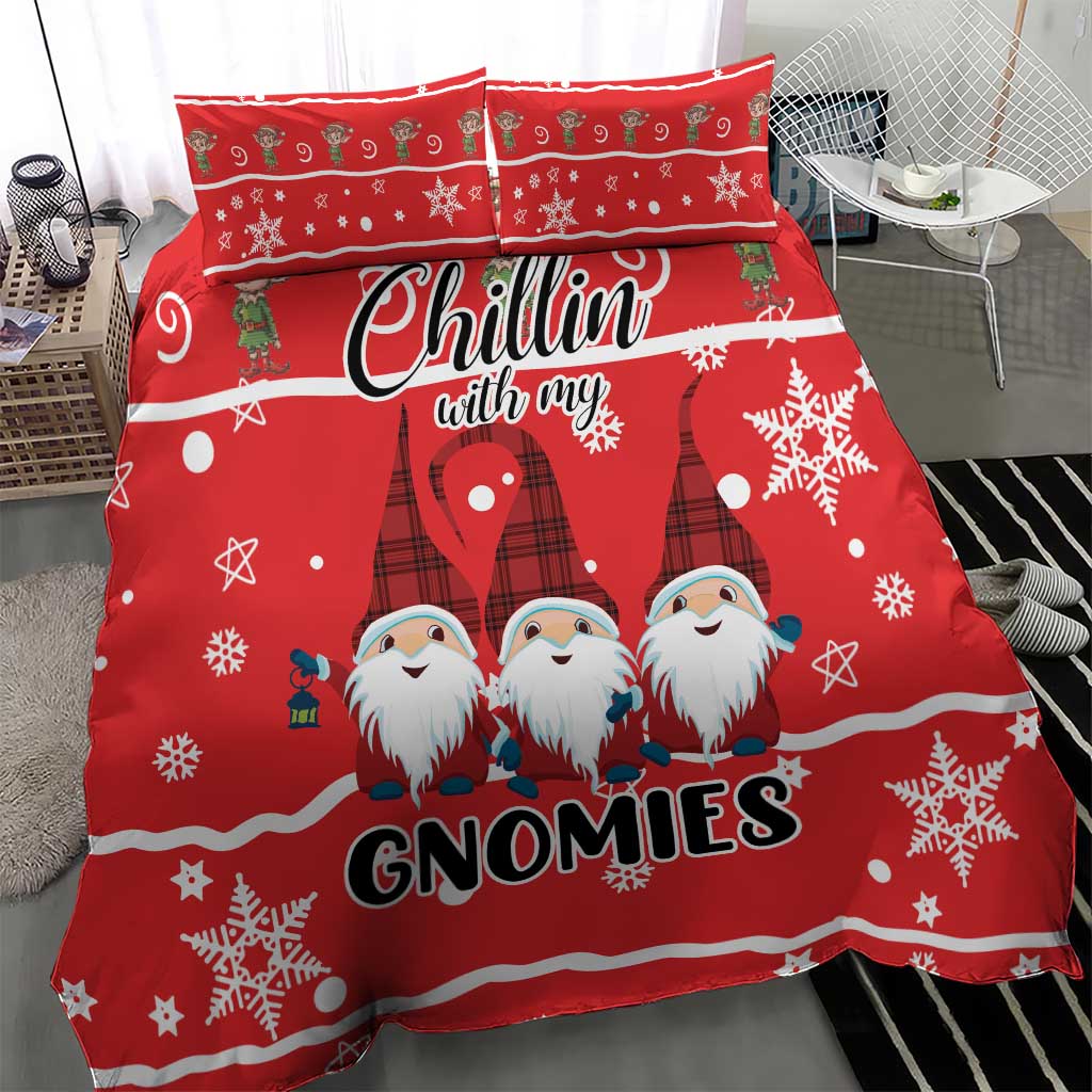 Red bedding set with three gnomes, snowflakes, and “GNOMIES” text on the duvet