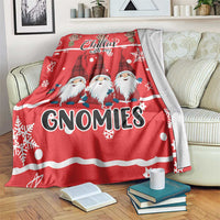 Red gnomies Christmas blanket over a couch, with “Chillin” script and “GNOMIES” headline