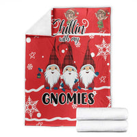 Red Christmas gnomies blanket folded, showing “Chillin with my GNOMIES” and snowflake patterns
