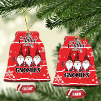 Red ceramic bell-shaped ornament pair with gnomes design; front and back labels.