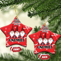 Red ceramic star-shaped ornaments with gnomes graphic, gold hanging loops, front/back.
