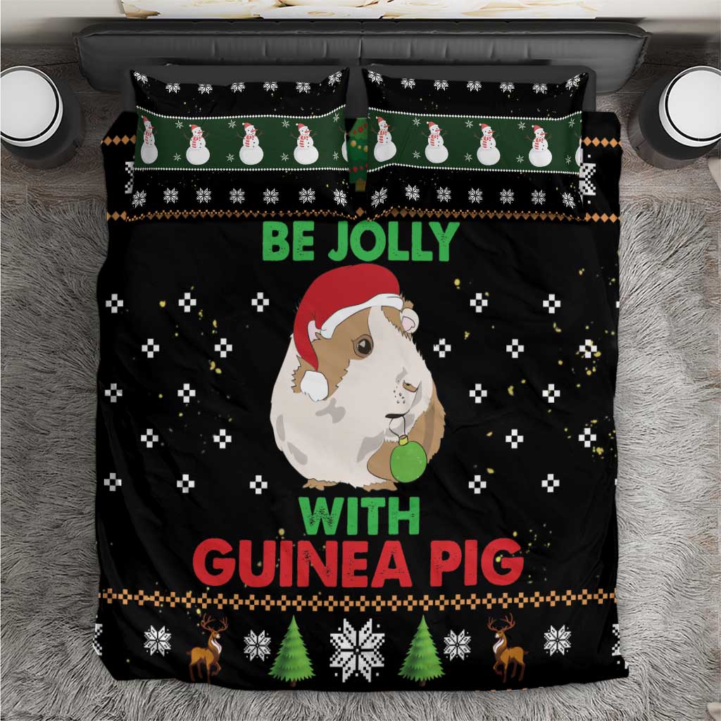 Black Christmas bedding set with guinea pig graphic, “Be Jolly” text, and holiday icons
