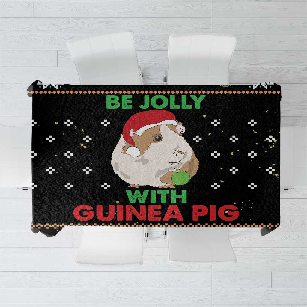 Black Christmas tablecloth with “Be Jolly” guinea pig print and patterned border