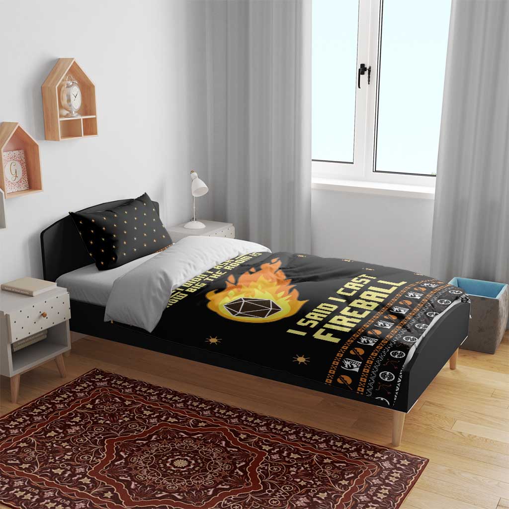 Black bedding set with fireball artwork across duvet and two matching pillowcases